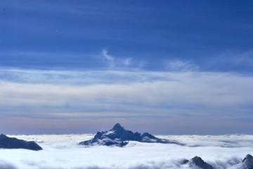 Fototapeta na wymiar lonely mountain in the clouds on the horizon.