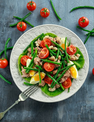 Fresh Tuna Green Bean salad with eggs, tomatoes, beans on white plate. concept healthy food