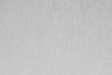 Detail of the facade of the house, wall plastered and painted in color, textured background