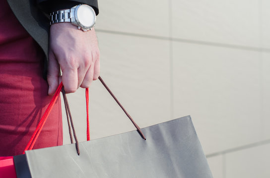 Male Hand Holding A Shopping Bag