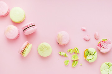 Group of homemade macarons on pink background