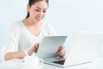 young pretty woman using laptop in office