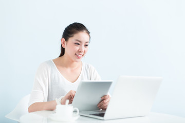 young pretty woman using laptop in office