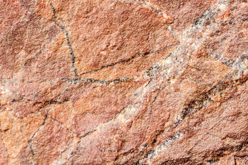 Stone, rock with brown tint texture, selective focus. For background , backdrop, substrate, composition use.