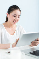 young pretty woman using laptop in office