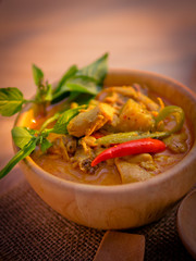  Thai traditional food style Thai vermicelli eaten with green curry chicken hot and spicy(Kanom jean keawwhan kai) on wooden background wallpaper focus one point shallow with depth of field