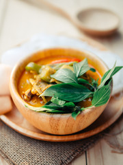  Thai traditional food style Thai vermicelli eaten with green curry chicken hot and spicy(Kanom jean keawwhan kai) on wooden background wallpaper focus one point shallow with depth of field