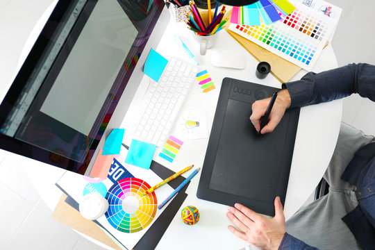 Modern designer working with graphic tablet - Powered by Adobe