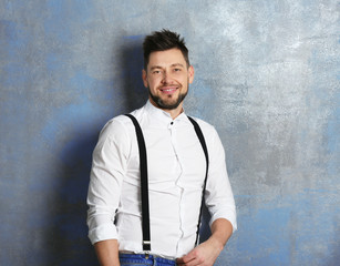 Obraz premium Handsome young man posing on gray background