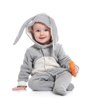 Cute little baby in bunny costume with carrot on white background Stock  Photo | Adobe Stock