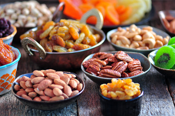 Healthy food - raisins, dried cranberries, kiwi, apricots, papaya, pistachios, cashews, almonds and more.