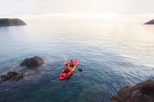 aerial view of kayak in the sea at sunset beach