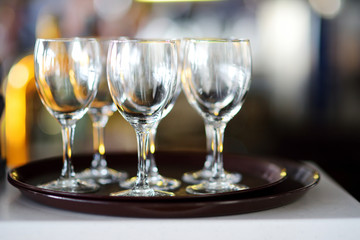 Lots of wine glasses during some festive event