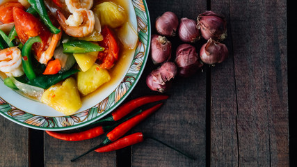 Vintage style Thai traditional food sweet and sour fried with shrimp on top able plan view and focus one point shallow with depth of field