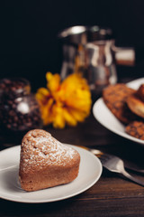 cupcake in a plate and a yellow flower in the background, a bucket