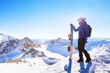 young woman with snowboard, winter holidays in Austria, panoramic mountain landscape of Alps © Song_about_summer