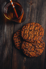 oatmeal cookies, drink in a glass, wooden background