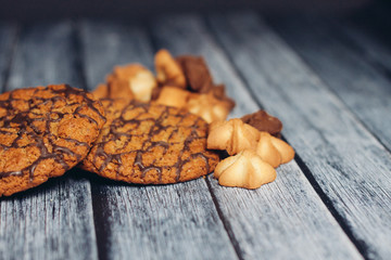 wooden background and different cookies