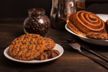 oatmeal cookies with chocolate and bun with cinnamon