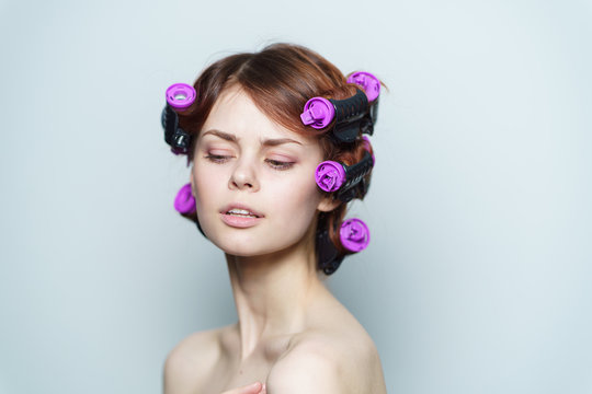 woman with purple hair curlers on her head, hair
