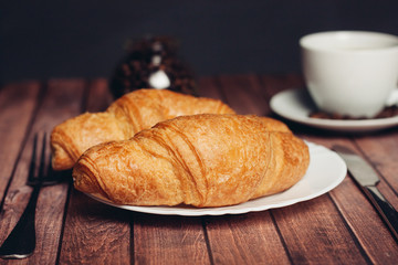  sweets, coffee mug tea on the table, croissant
