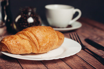 Biscuits, sweets, coffee mug tea on the table, croissant
