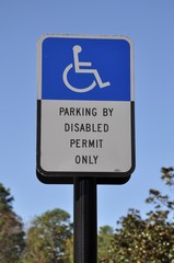 Parking by disabled permit only sign