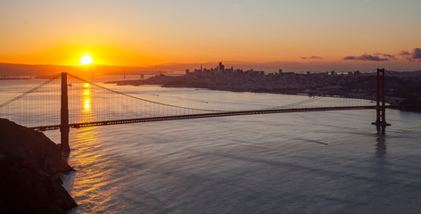 Sun Shinning OVer the Mountains of San Francisco with the Golden Gate Brdige in the Foreground © porqueno
