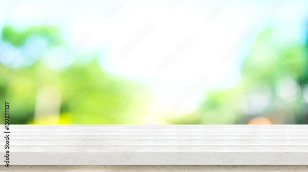 Poster empty white rustic wood table top with blur blue green tree boekh background,mock up template for di
