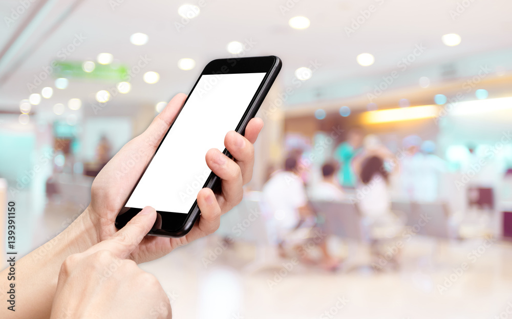 Aufkleber Hand click mobile phone with blur patient at hospital background bokeh light,White screen mock up template for adding your design or your text