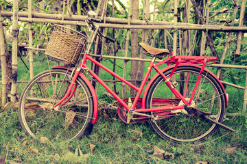 Fototapeta na wymiar red vintage bicycle Parking is inside the palisade