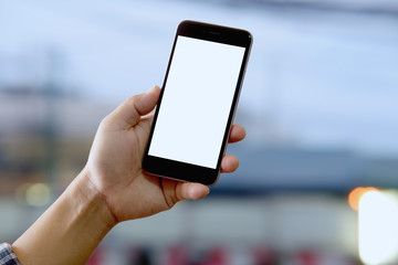 Man using smartphone at street night.