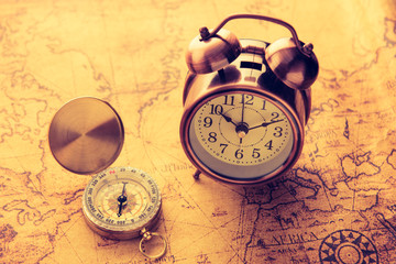 Compass and alarm clock classic style on old map,vintage process tone style