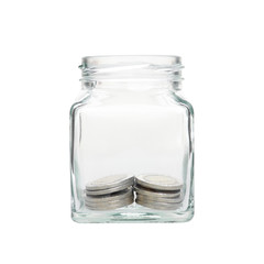Investment growth concept,money coins in clear jar over white background,saving money