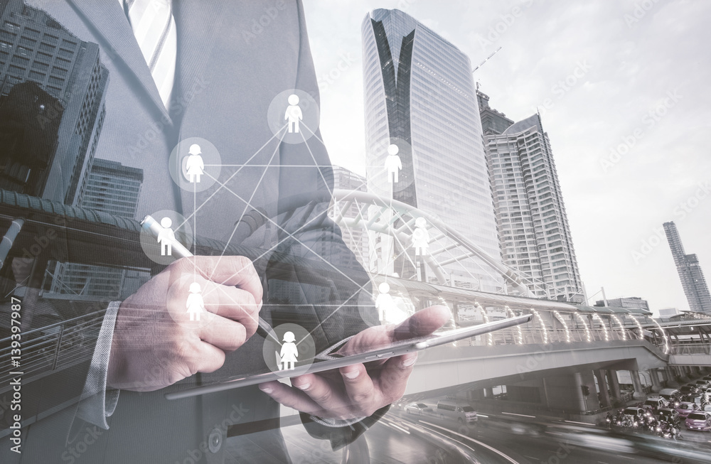 Aufkleber double exposure of success businessman using digital tablet with social media network diagram,intern