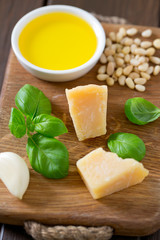 pesto ingredients on wooden surface