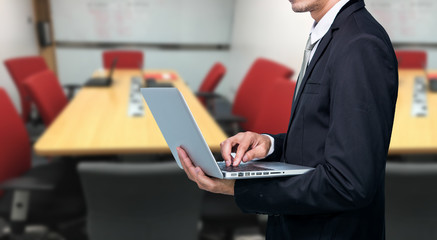 Businessman hold laptop computer