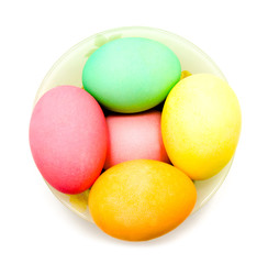 Colorful easter eggs in bowl isolated