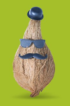 Funny coconut boss with a mustache, a hat and sunglasses. Business character photo isolated white background with clipping path