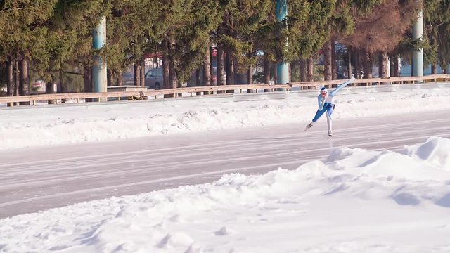 Speed ice skater skating on outdoor race HD slow-motion video. Professional athlete training for winter olympic