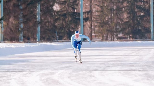 Speed ice skater skating on outdoor race HD slow-motion video. Professional athlete training for winter olympic