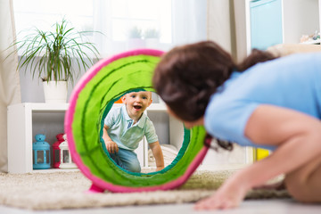 Mother with child playing in the home