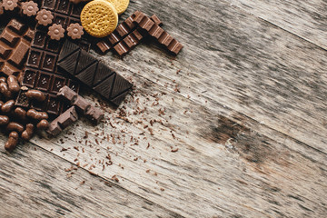 Chocolate and biscuits on a wooden background