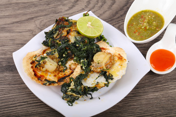 Baked scallops with spinach