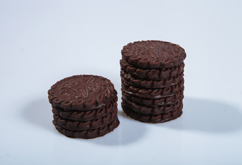 Cookies in chocolate glaze on a light background