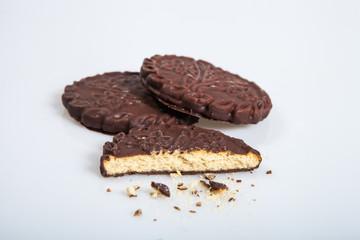 Cookies in chocolate glaze on a light background
