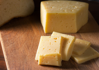 Sliced cheese on a cutting Board