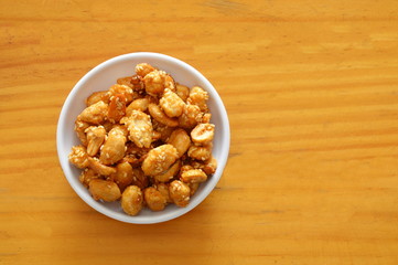 sweet crispy peanut in cup on table