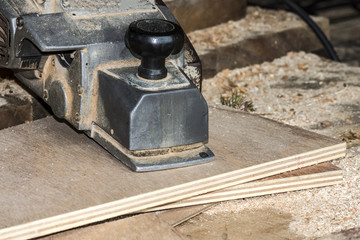 wooden plane in a workshop of the carpenter