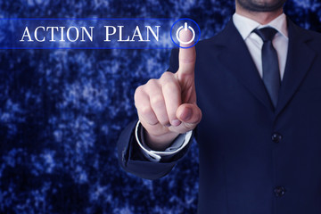 Businessman clicking action plan button.